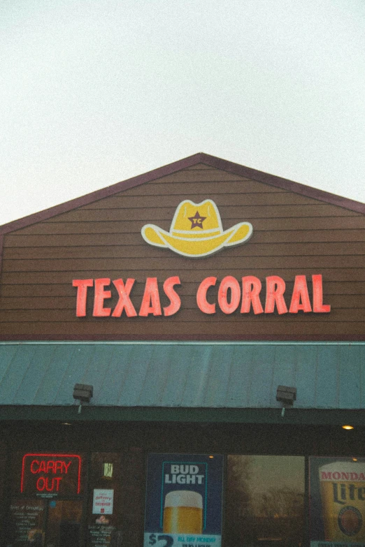 the entrance to a texas corn venue with a large sign over it