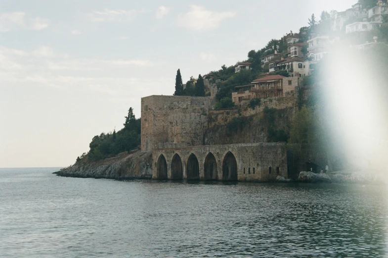 some very pretty buildings on the edge of a large body of water