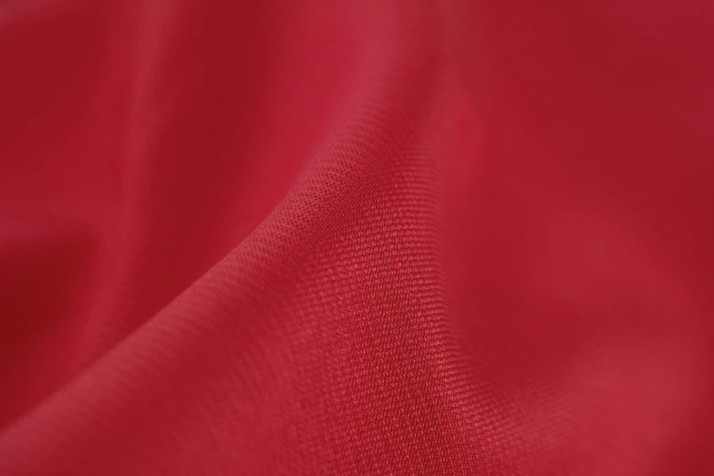 a red fabric that is very close up