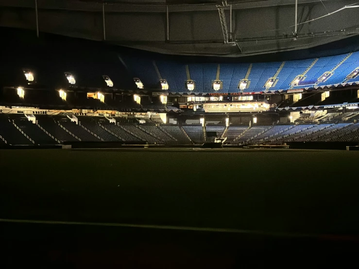 the interior of a stadium, where the lighting is on