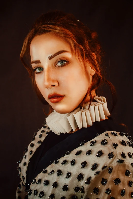 a woman with blue eyes posing for the camera