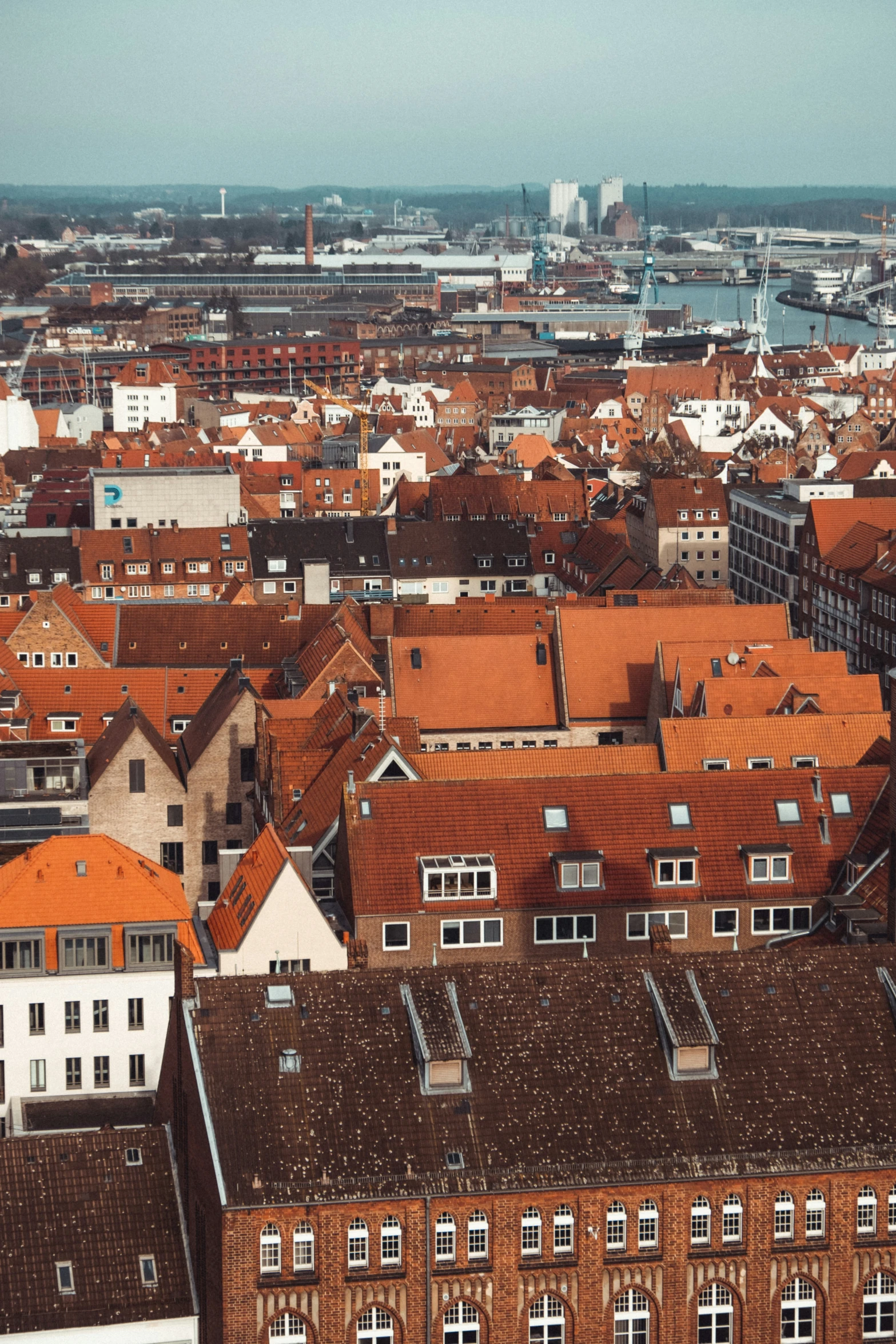 a view of the old city with lots of red tile roofs