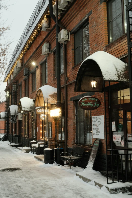 a snowy street with light poles on both sides