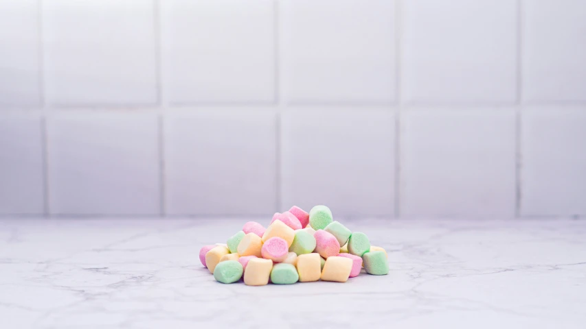 candy sits in front of the camera on a white countertop