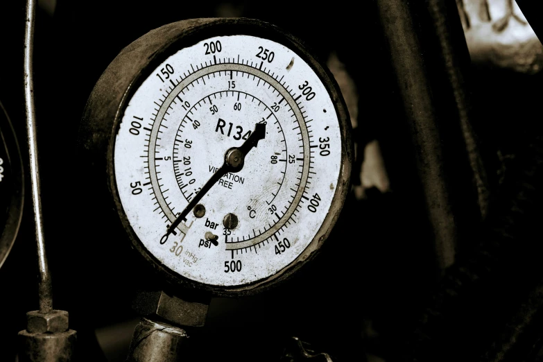 two gauges with arrows and red numbers displayed