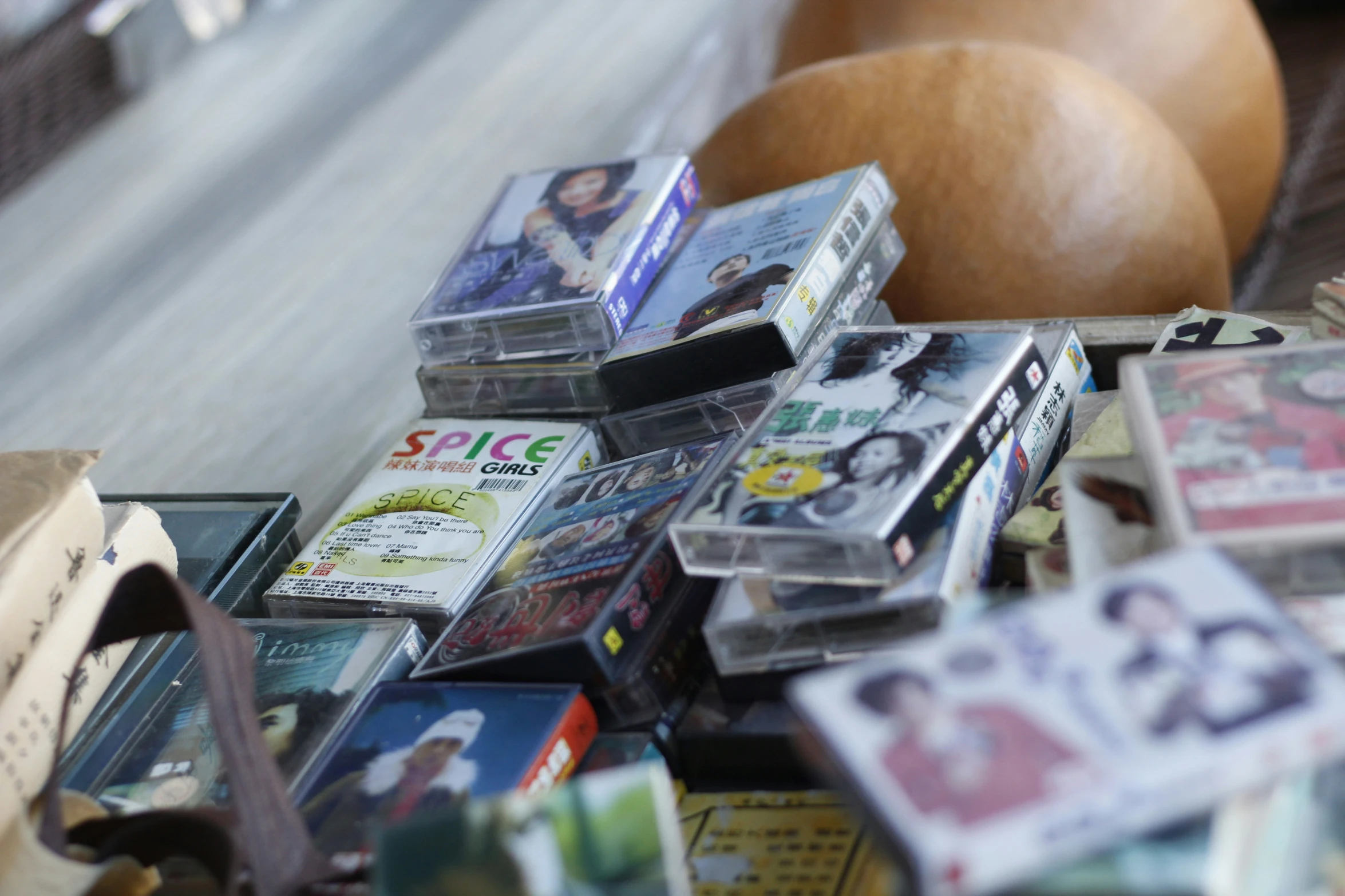 a bunch of dvds sitting on top of a shelf