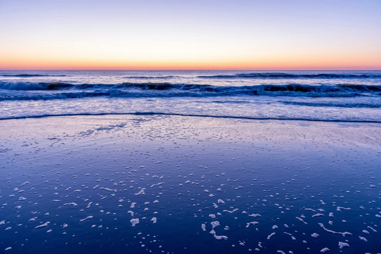 a picture of some water at a beach