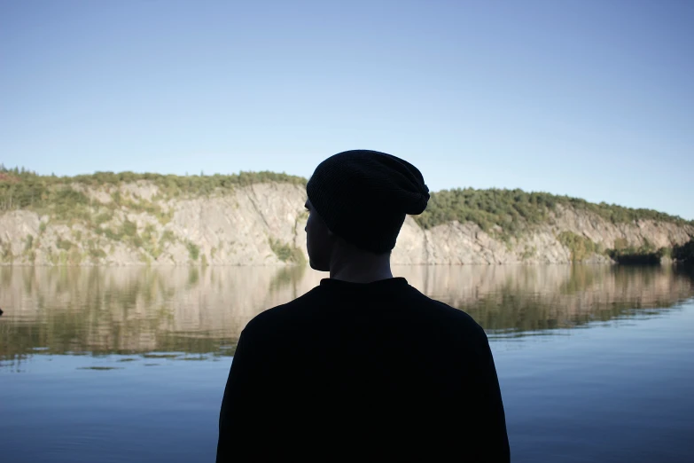 a person that is looking at the water